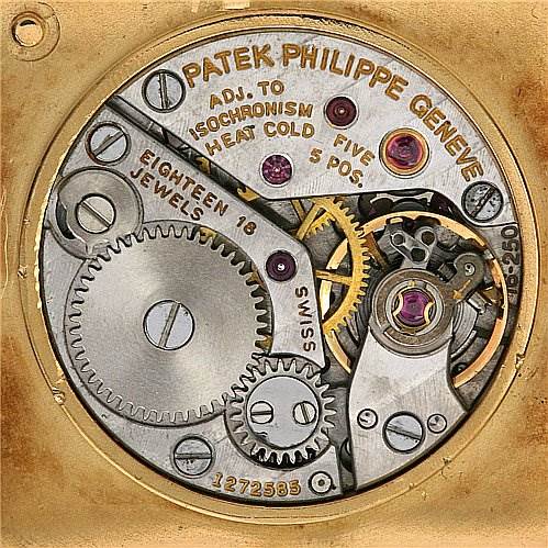 This image shows the movement mechanism of a Vintage Patek Philippe watch, highlighting the gears and intricate components.