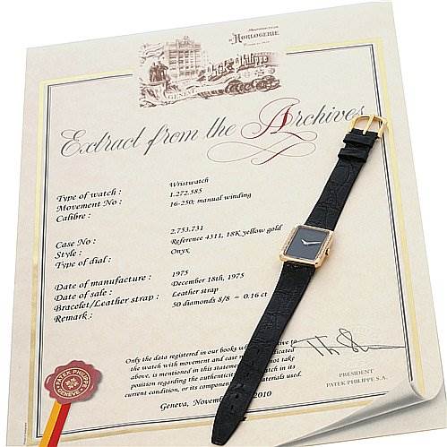 The image shows a Patek Philippe Vintage 4311 Women's Yellow Gold Black Dial 4311 Women's Yellow Gold Black Dial watch placed on a certificate from the brand, displaying a square dial and a black strap.