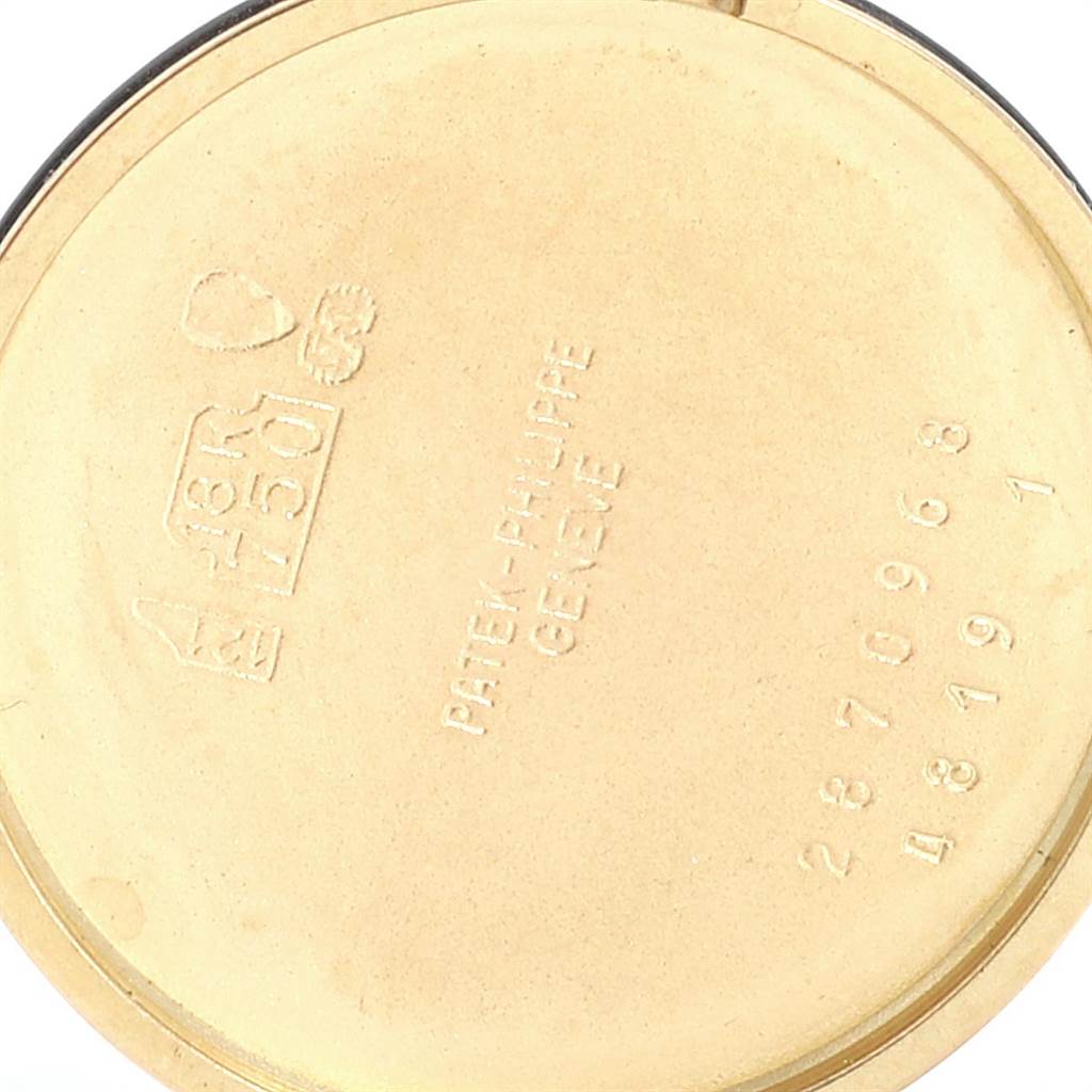 The image shows the inner case back of a Calatrava model watch by Patek Philippe, displaying hallmark and serial numbers.