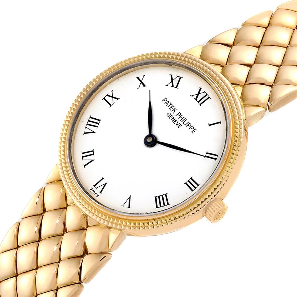 The image shows a Patek Philippe Calatrava 4819 Women's Yellow Gold White Dial 4819 Women's Yellow Gold White Dial watch from a top angle, highlighting the dial, bezel, crown, and strap.