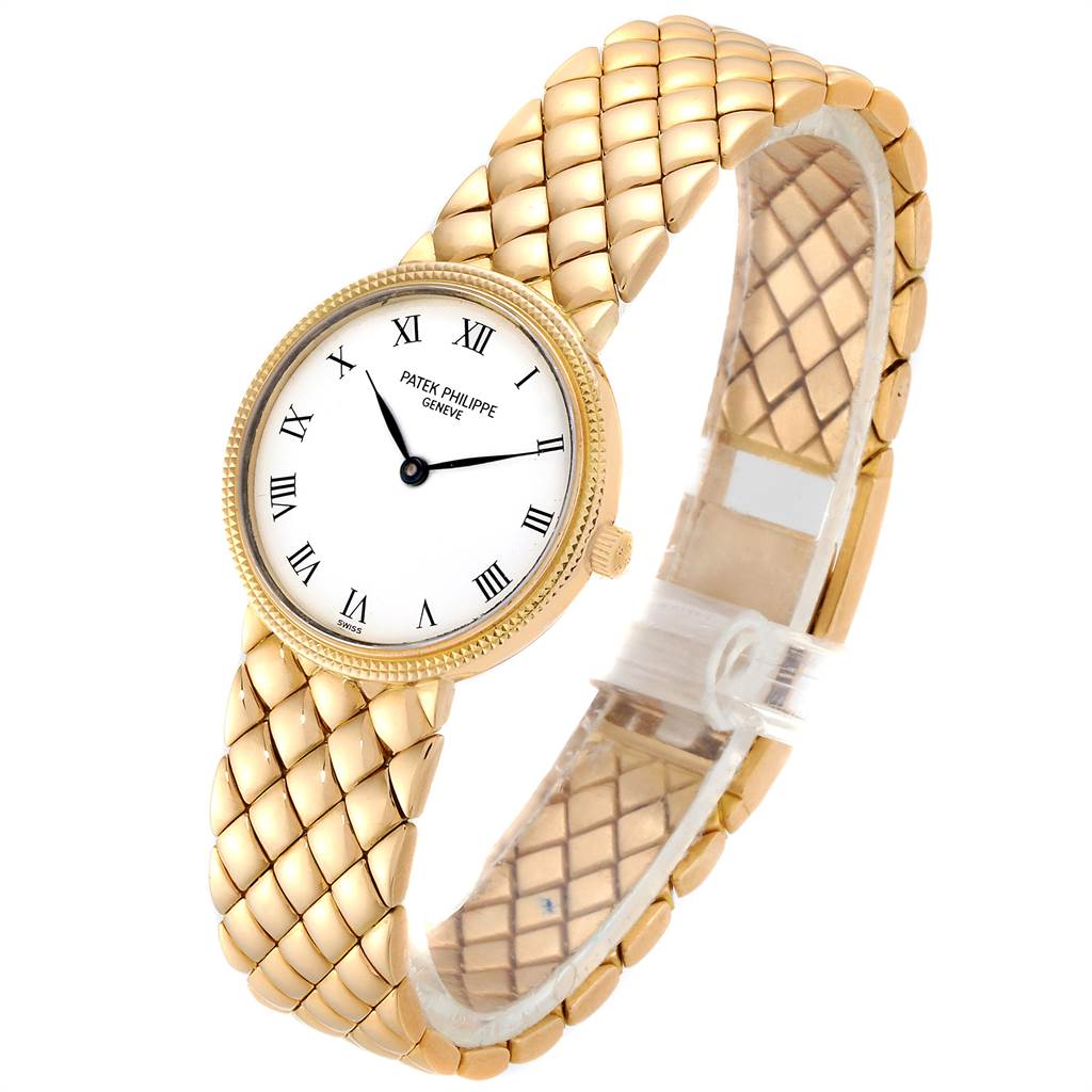 The image shows a gold Patek Philippe Calatrava 4819 Women's Yellow Gold White Dial 4819 Women's Yellow Gold White Dial watch angled to display the face and part of the strap.