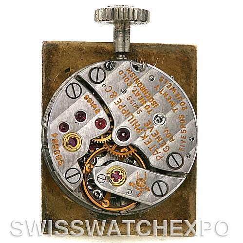 The image shows the intricate internal mechanism of a Vintage Patek Philippe watch from a top-down angle.