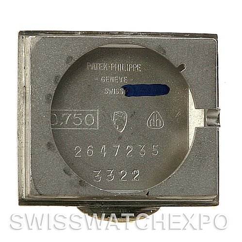 This image shows the caseback interior of a Vintage Patek Philippe watch, displaying engravings and markings.