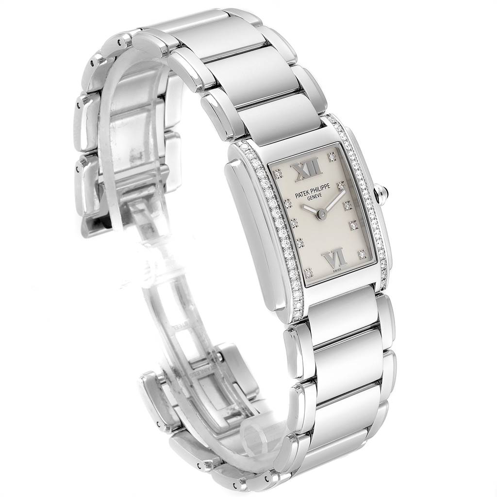 This image shows a Patek Philippe Twenty-4 4910 Women's Stainless Steel Silver Dial 4910 Women's Stainless Steel Silver Dial watch at a side angle, highlighting its rectangular face and metallic bracelet.