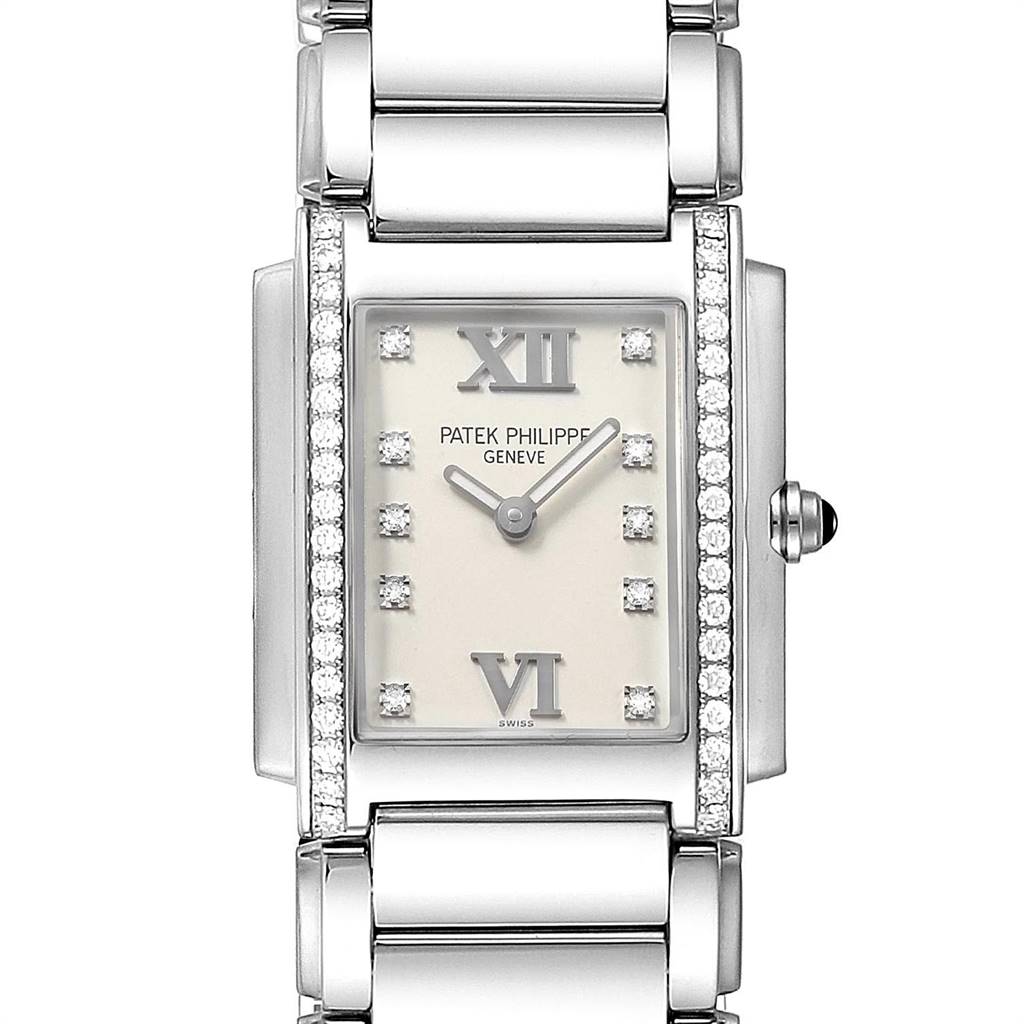 The image shows a close-up view of the face and bracelet of a Patek Philippe Twenty-4 4910 Women's Stainless Steel Silver Dial 4910 Women's Stainless Steel Silver Dial watch, featuring a rectangular dial with Roman numerals and diamonds.