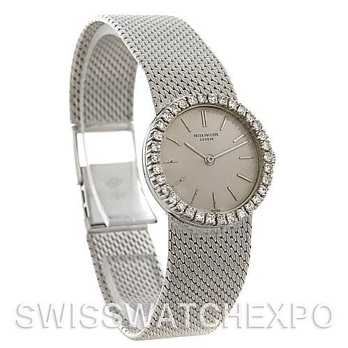 The image shows a side angle of a Patek Philippe Vintage 3337/3 Women's White Gold Silver Dial 3337/3 Women's White Gold Silver Dial model watch, highlighting its mesh band and diamond-bezel face.