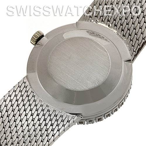 The image shows the back case and mesh bracelet of a Vintage Patek Philippe watch, focusing on the crown and part of the band.