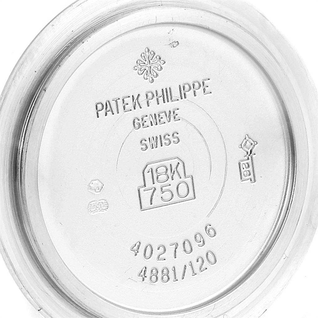 This is the case back of a Patek Philippe Neptune 4881-120G Women
s White Gold Mother of Pearl Dial 4881-120G Women
s White Gold Mother of Pearl Dial model watch, displaying various engravings and hallmarks.