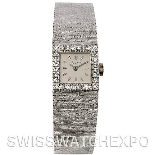 This image shows a front view of a Vintage Patek Philippe watch, highlighting its face, dial, bezel with diamonds, and textured bracelet.