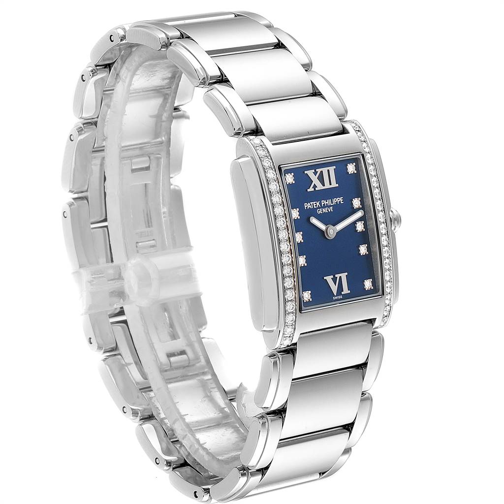The image shows a side angle of the Patek Philippe Twenty-4 4910-10A-012 Women's Stainless Steel Blue Dial 4910-10A-012 Women's Stainless Steel Blue Dial watch, highlighting its strap, rectangular dial, and diamond accents.