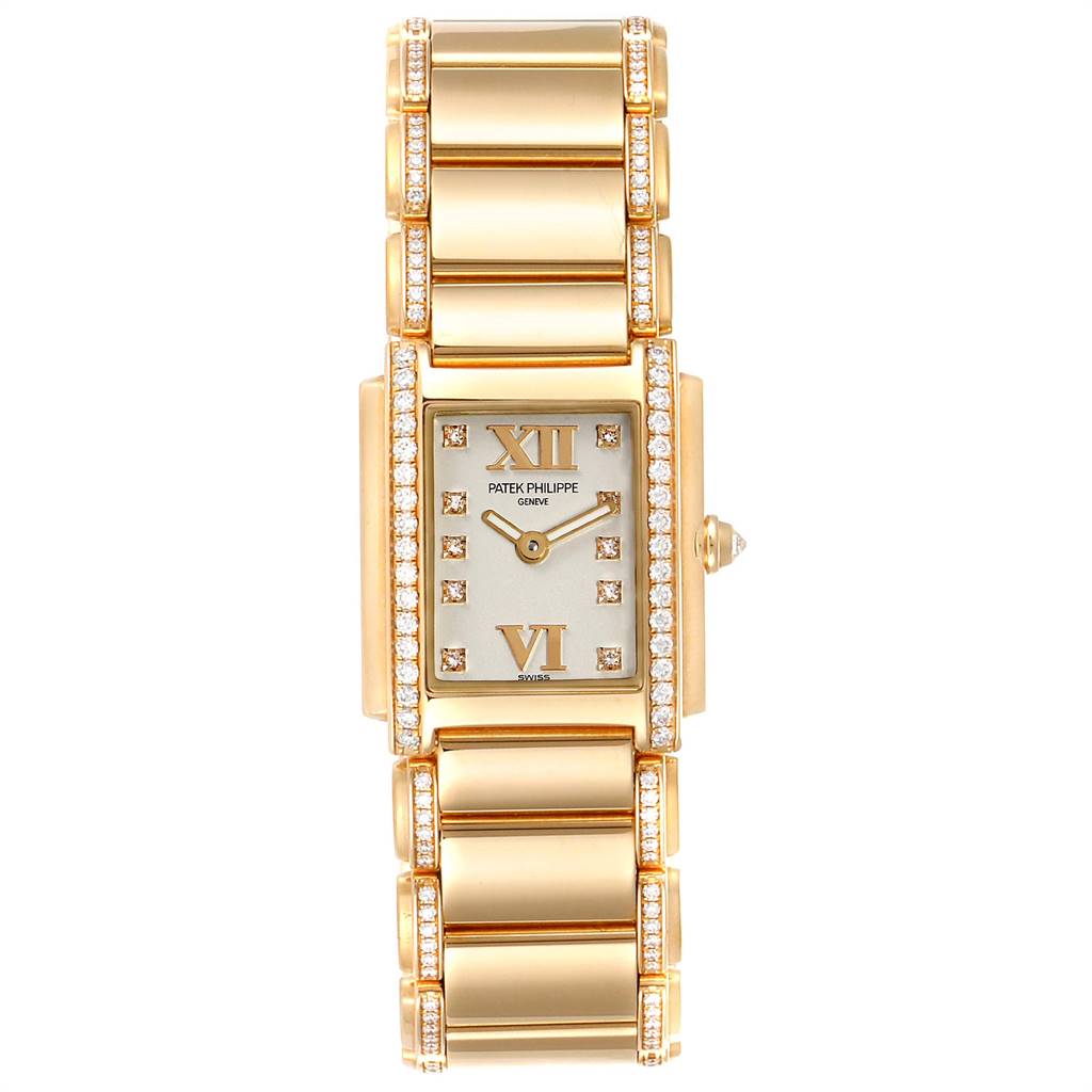 The Patek Philippe Twenty-4 4908/11R-011 Women's Rose Gold Silver Dial 4908/11R-011 Women's Rose Gold Silver Dial watch is shown from a top-down angle, displaying its rectangular face, gold bracelet, and diamond accents.