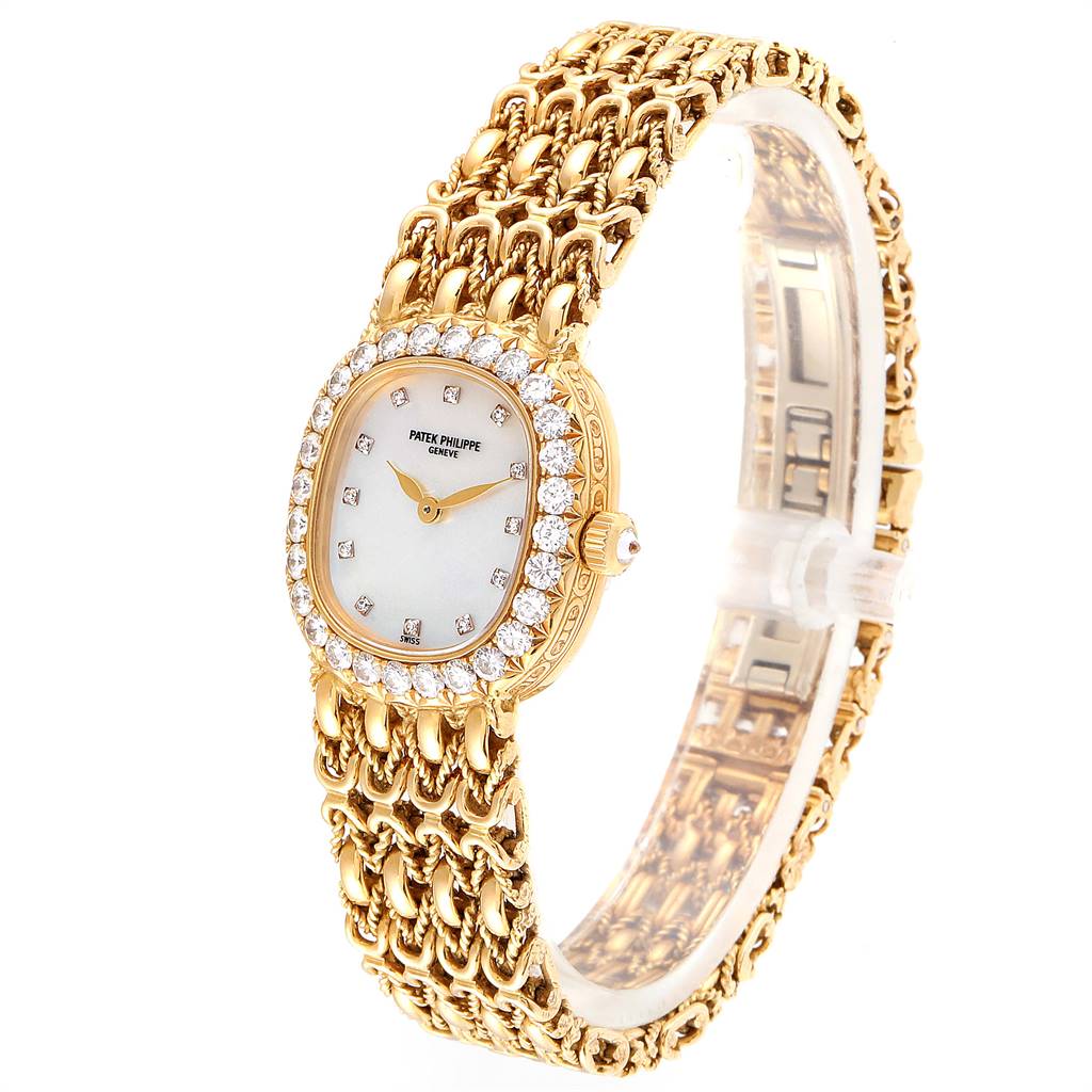 The image shows a Patek Philippe Golden Ellipse 4931/2 Women's Yellow Gold Mother of Pearl Dial 4931/2 Women's Yellow Gold Mother of Pearl Dial watch from a three-quarter angle, highlighting the dial, bezel, and bracelet.