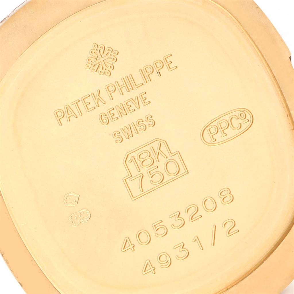 This image shows the back casing with engravings of the Patek Philippe Golden Ellipse 4931/2 Women's Yellow Gold Mother of Pearl Dial 4931/2 Women's Yellow Gold Mother of Pearl Dial watch.