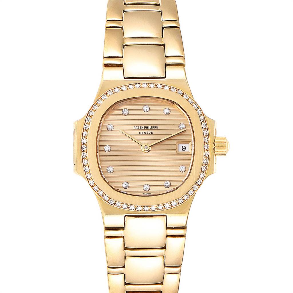 The image shows a front view of a Patek Philippe Nautilus 4700 Women's Yellow Gold Champagne Dial 4700 Women's Yellow Gold Champagne Dial watch, highlighting its gold bracelet, diamond bezel, and date window.