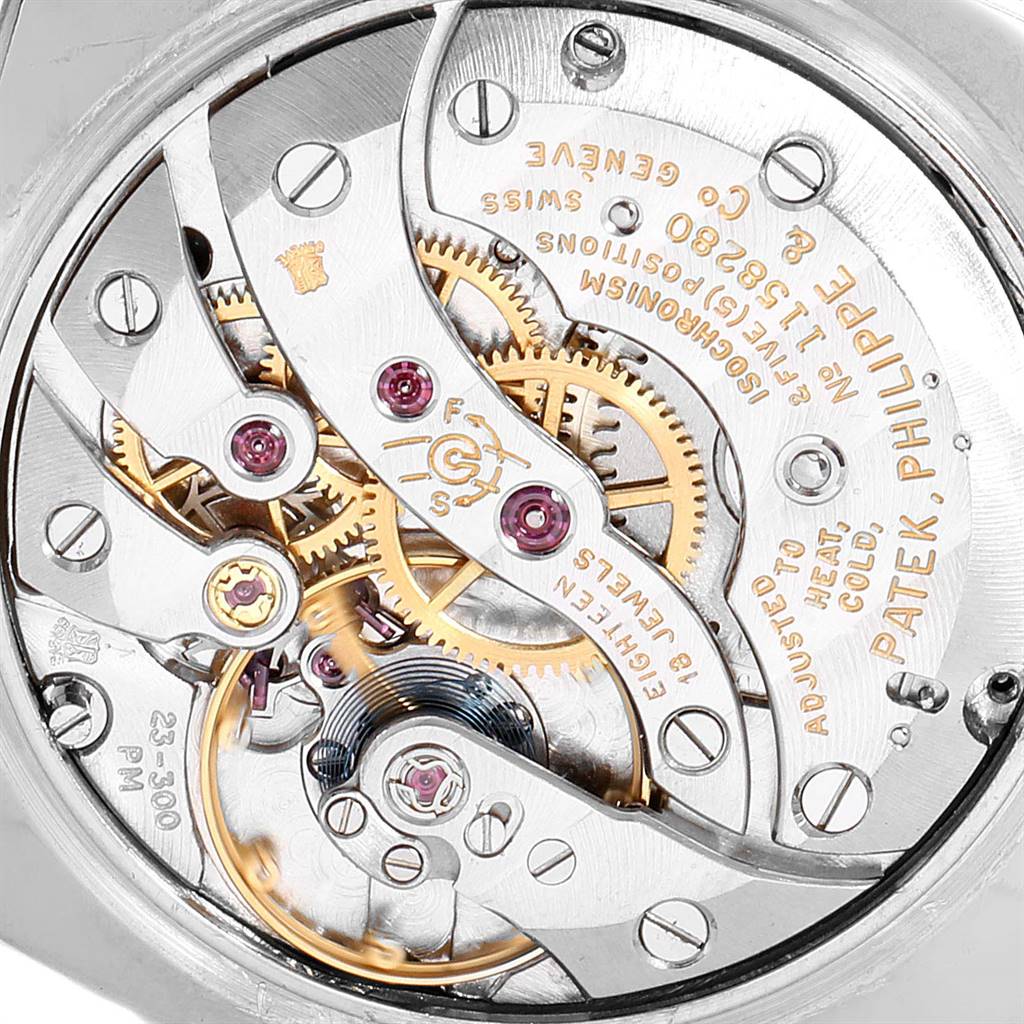 This image shows the intricate inner mechanics and movement of the Patek Philippe Golden Ellipse 3548 Women's White Gold Black Dial 3548 Women's White Gold Black Dial watch from a close-up angle.