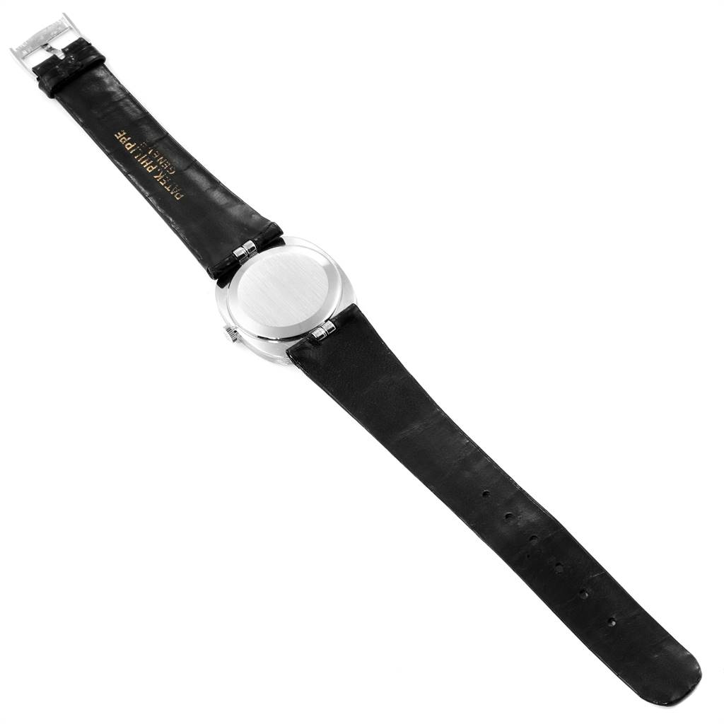 The image shows the back of the Patek Philippe Golden Ellipse 3548 Women's White Gold Black Dial 3548 Women's White Gold Black Dial watch, displaying the case back and leather strap.