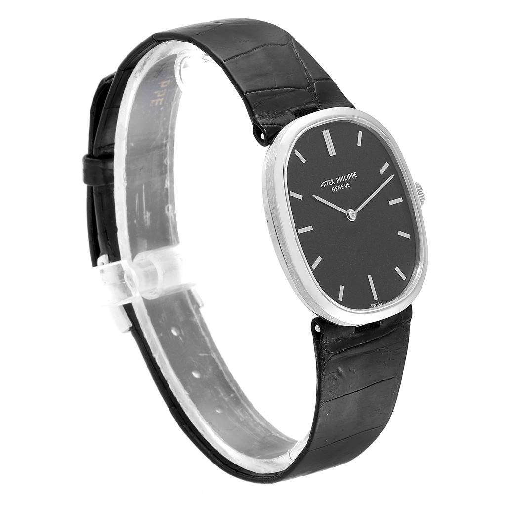 The image shows a side angle view of a Patek Philippe Golden Ellipse 3548 Women's White Gold Black Dial 3548 Women's White Gold Black Dial watch, highlighting the black dial, silver hands, and black leather strap.