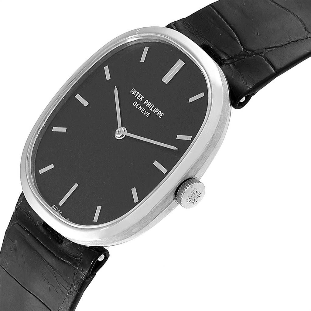 This image shows a Patek Philippe Golden Ellipse 3548 Women's White Gold Black Dial 3548 Women's White Gold Black Dial watch at a slight angle, displaying its black dial, silver hands, crown, and black leather strap.