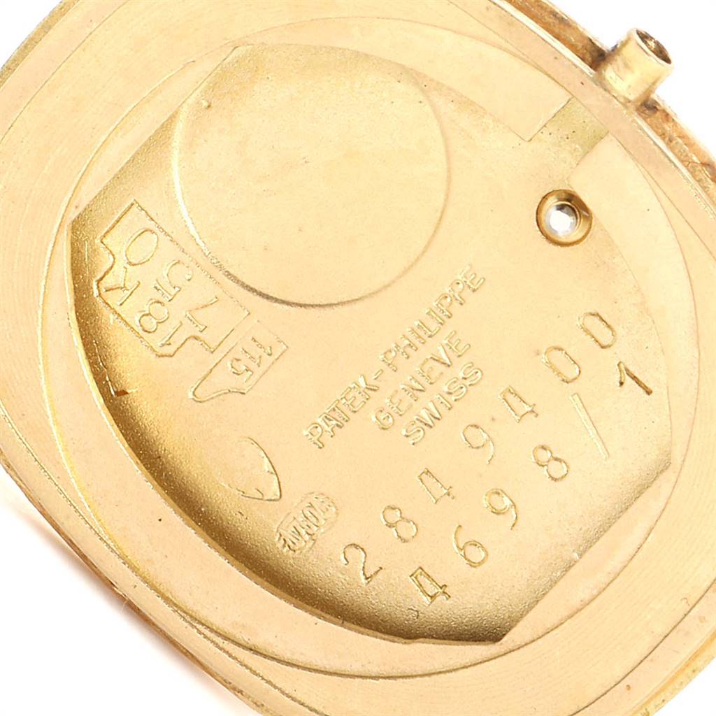 The image shows the back of a Patek Philippe Golden Ellipse 4698/1 Women's Yellow Gold Blue Dial 4698/1 Women's Yellow Gold Blue Dial watch, highlighting the internal markings and hallmarks.