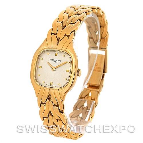 The image shows a Patek Philippe Vintage 4715/1 Women's Yellow Gold White Dial 4715/1 Women's Yellow Gold White Dial model watch from a front-angle view, highlighting its gold case, dial, and bracelet.