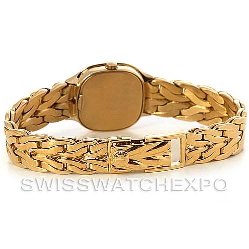 This image shows the back of a Patek Philippe Vintage 4715/1 Women's Yellow Gold White Dial 4715/1 Women's Yellow Gold White Dial watch, highlighting its gold bracelet and clasp.