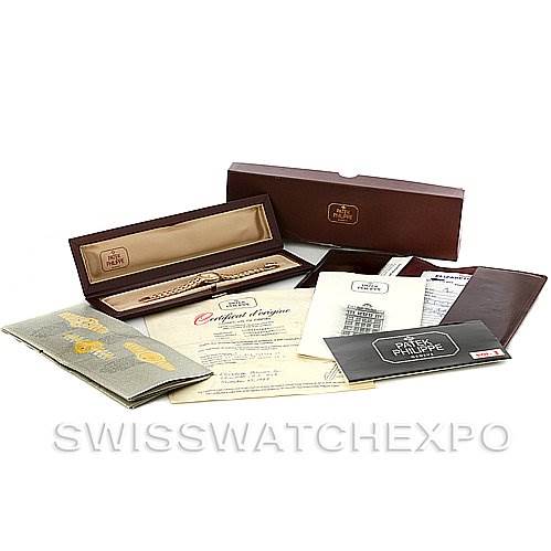 The image shows the packaging and documentation for a Vintage Patek Philippe watch, including the watch box, warranty card, and manuals.