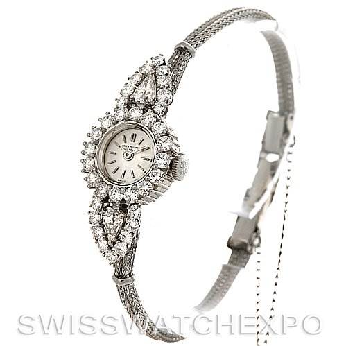 The image shows a side angle of the Vintage Patek Philippe watch featuring a diamond-accented bezel and a mesh bracelet.