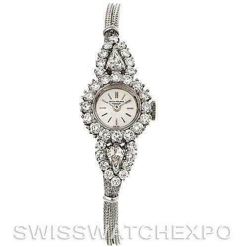 This is a front view of a Vintage Patek Philippe watch, showcasing its face, bezel, and bracelet adorned with diamonds.