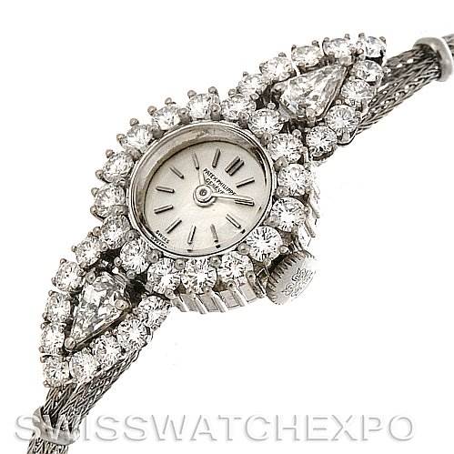 The image shows a Vintage Patek Philippe watch from an angle that highlights its diamond-studded bezel and mesh bracelet.
