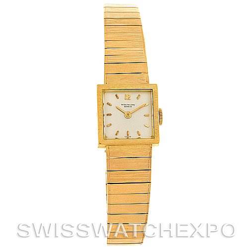 This image shows the front view of a Vintage Patek Philippe watch, highlighting its square dial and gold bracelet.