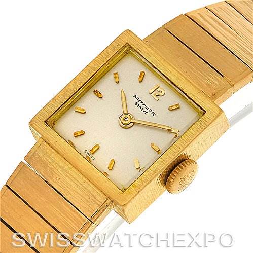 This Vintage Patek Philippe watch is shown from an angle displaying the dial, crown, and part of the band.