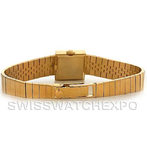 The image shows the back view of a Vintage Patek Philippe watch, highlighting its gold bracelet and clasp.