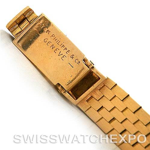 The image shows the clasp and part of the bracelet of a vintage Patek Philippe watch, engraved with the brand and location.