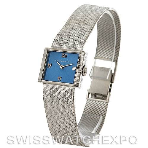 This image shows a side angle of the Vintage Patek Philippe watch, highlighting its blue square dial, textured band, and clasp.