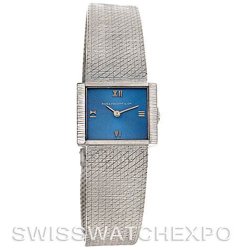 This image shows a front view of a Vintage Patek Philippe watch with a blue dial and a textured silver bracelet.