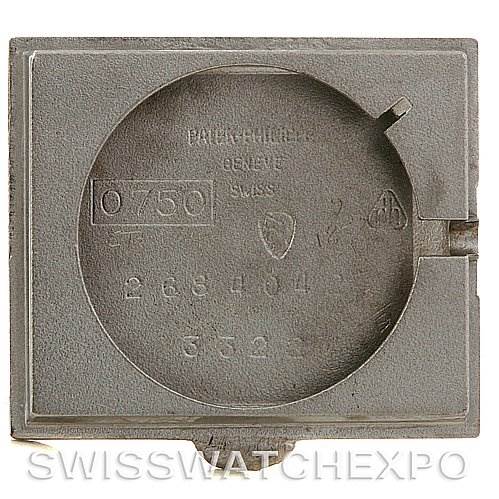 The image shows the case back of a Vintage Patek Philippe watch with engravings including serial numbers.