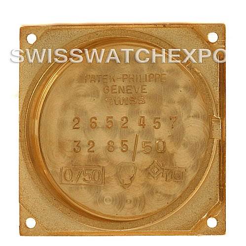 This image shows the inner case back of a Vintage Patek Philippe watch, displaying model numbers and gold hallmark stamps.