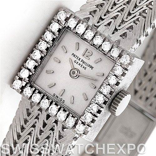 The image shows a close-up view of the face and part of the band of a Vintage Patek Philippe watch with a diamond-encrusted bezel.