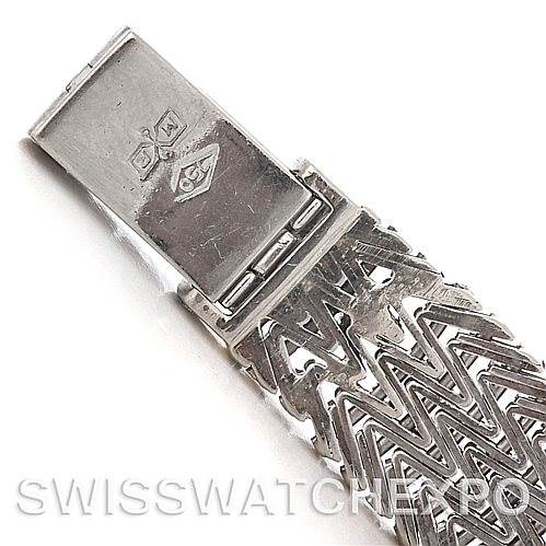 This image shows a close-up angle of the clasp and metal bracelet of a Vintage Patek Philippe watch.