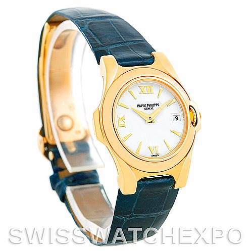 The image shows a Patek Philippe 4890 Women's Yellow Gold White Dial 4890 Women's Yellow Gold White Dial 4890 Ladies Watch made of 18k yellow gold, displayed at an angle highlighting the watch face, case, and black strap.