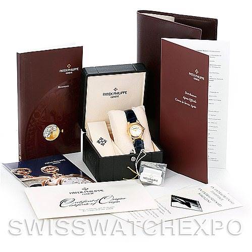 The image shows a Patek Philippe 4890 Women's Yellow Gold White Dial 4890 Women's Yellow Gold White Dial 4890 18k Yellow Gold Ladies Watch set, including the watch, box, certificates, and booklets.