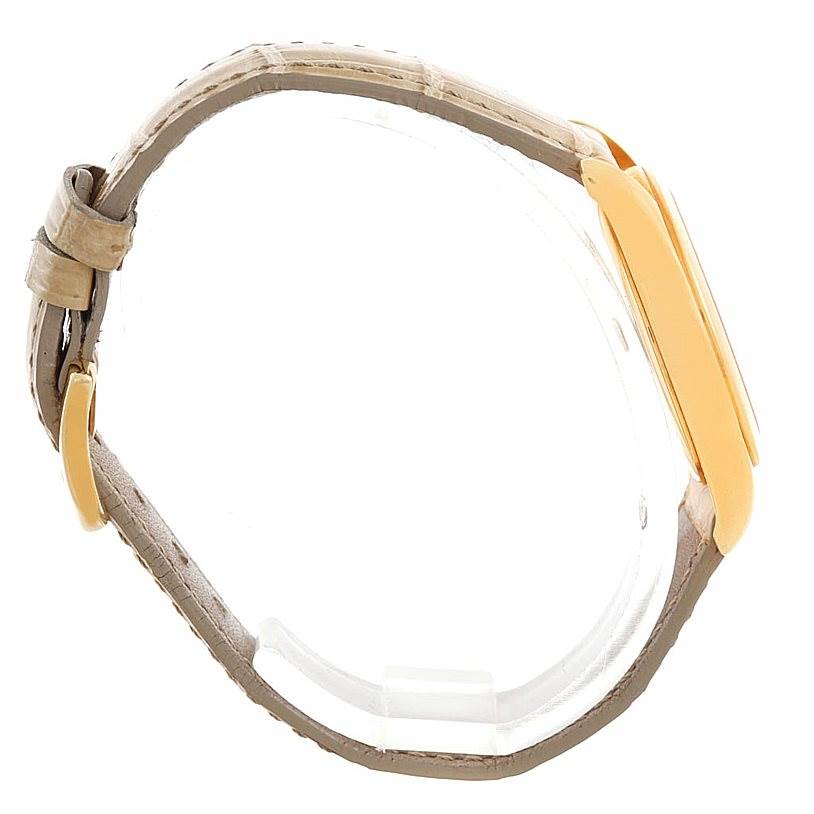 The side view of the Patek Philippe 4906J Women's Yellow Gold White Dial 4906J Women's Yellow Gold White Dial 4906J Ladies Watch showcases the yellow gold case and beige leather strap.