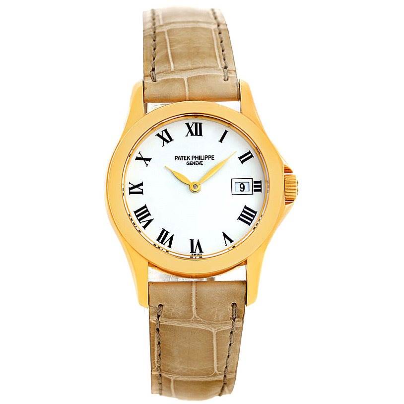The image shows a front view of a Patek Philippe 4906J Women's Yellow Gold White Dial 4906J Women's Yellow Gold White Dial 4906J 18k Yellow Gold Ladies Watch, displaying the dial, bezel, and leather strap.