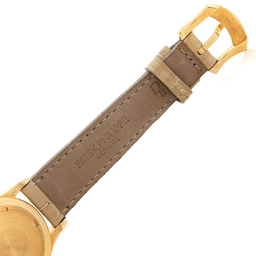 This image shows the back of the Patek Philippe 4906J Women's Yellow Gold White Dial 4906J Women's Yellow Gold White Dial 4906J 18k Yellow Gold Ladies Watch, highlighting the strap and buckle.