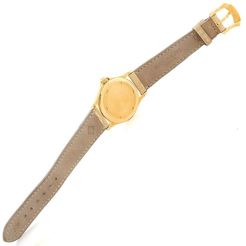 The image shows the back view of the Patek Philippe 4906J Women's Yellow Gold White Dial 4906J Women's Yellow Gold White Dial 18k Yellow Gold Ladies Watch 4906J, displaying the strap, buckle, and case back.