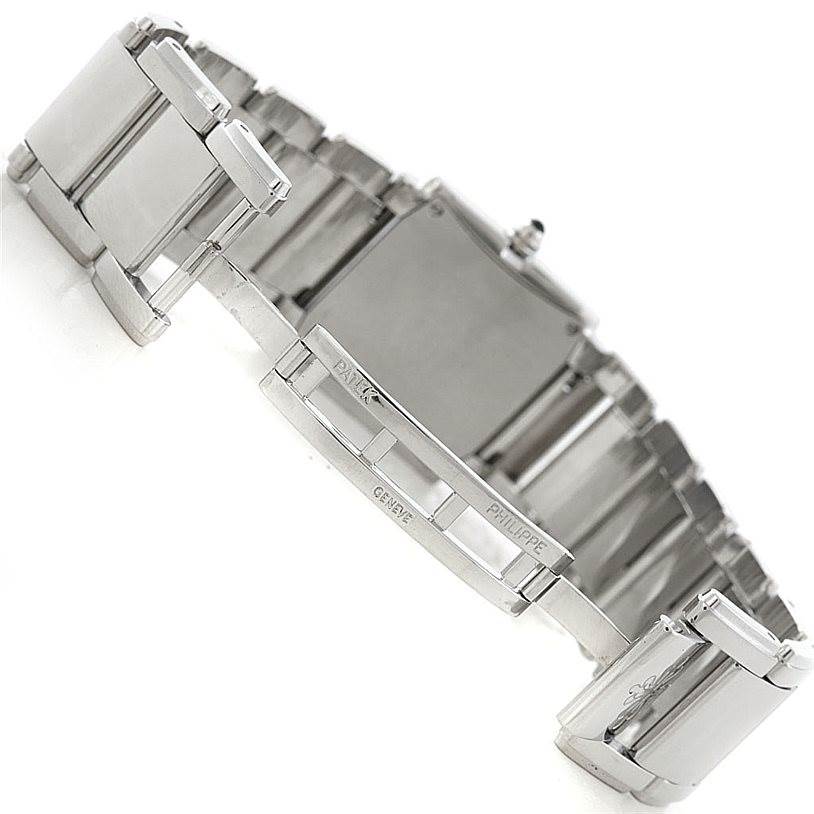 The image shows the clasp and part of the bracelet of a Patek Philippe Twenty-4 4910/10A-011 Women's Stainless Steel Silver Dial 4910/10A-011 Women's Stainless Steel Silver Dial watch at an oblique angle.