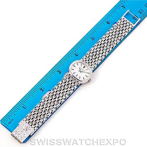 This image shows a vintage Patek Philippe watch laid flat, with a ruler for size reference, displaying the face and full bracelet.