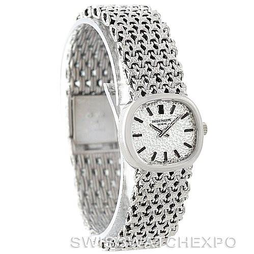 This image shows a side angle of a Vintage Patek Philippe watch, focusing on its silver mesh bracelet and rectangular dial.