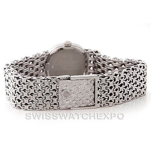 The image shows the back view of a Vintage Patek Philippe watch, focusing on its intricate metal bracelet and clasp.