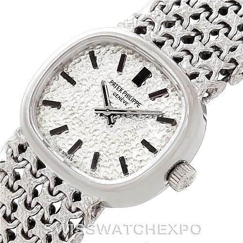 This image shows a close-up, top-down view of a Vintage Patek Philippe watch featuring the face and part of the metal band.